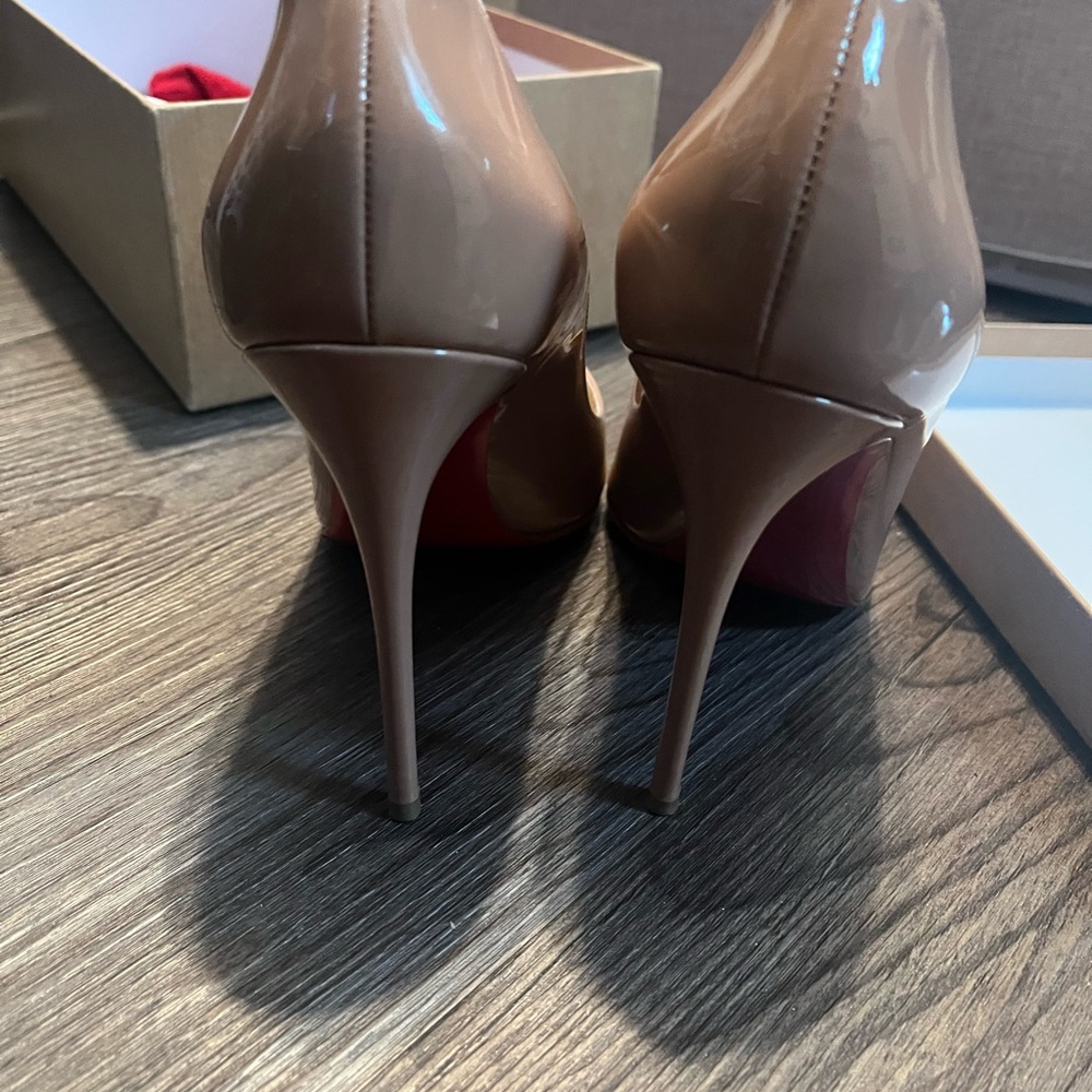 Christian Louboutin Pigalle Follies 100 Patent leather pumps.